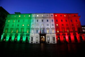 Palazzo Chigi illuminated with the colours of the Italian flag